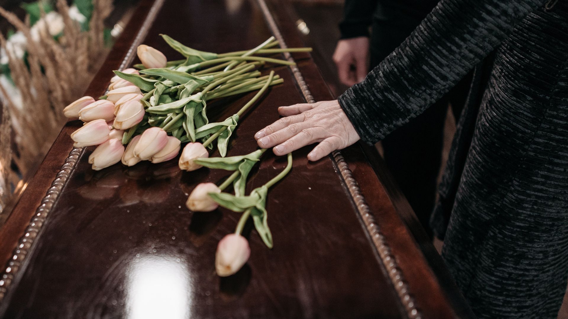A Person Holding the Coffin A Person Holding the Coffin